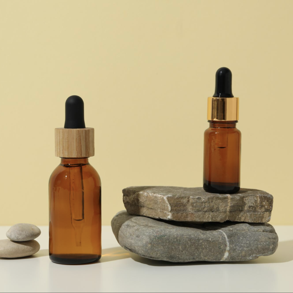 two serums on top of rocks aesthetic